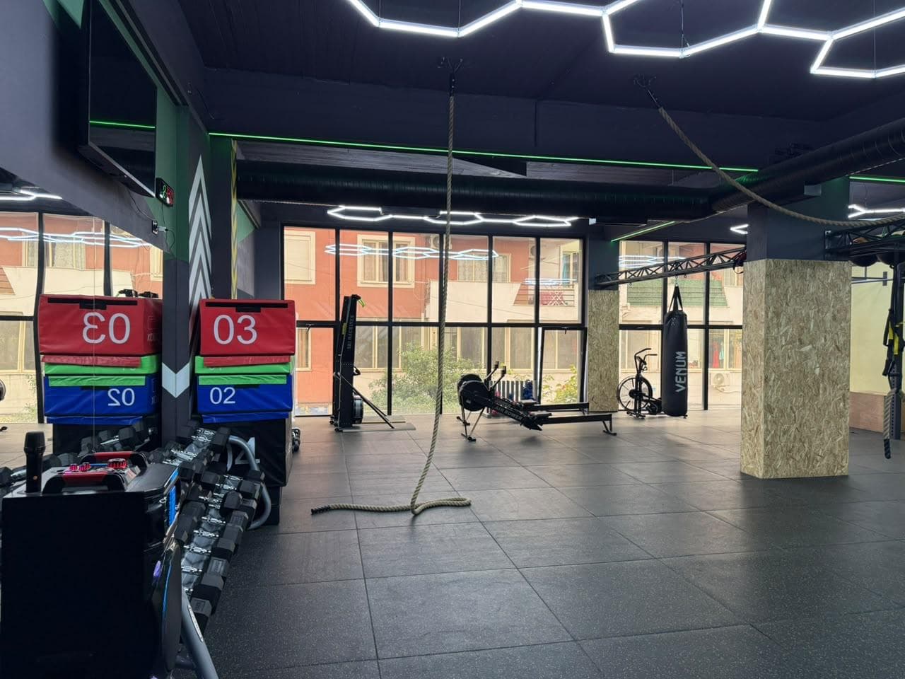 Plyo boxes, a battle rope and an air bike in the functional training zone at My Fitness